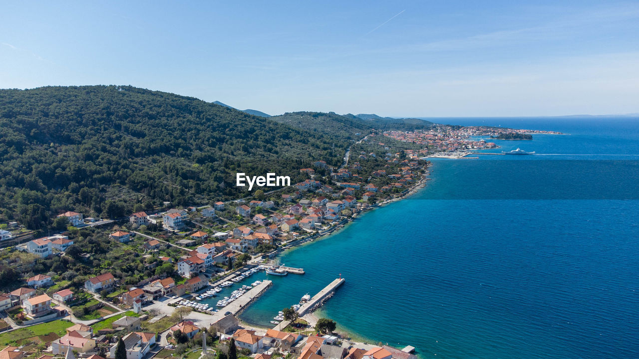 High angle view of townscape by sea against sky of kali town on island ugljan