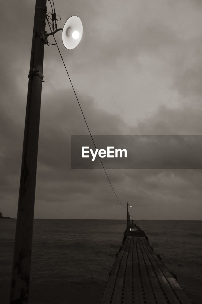 SCENIC VIEW OF PIER AT SEA AGAINST SKY