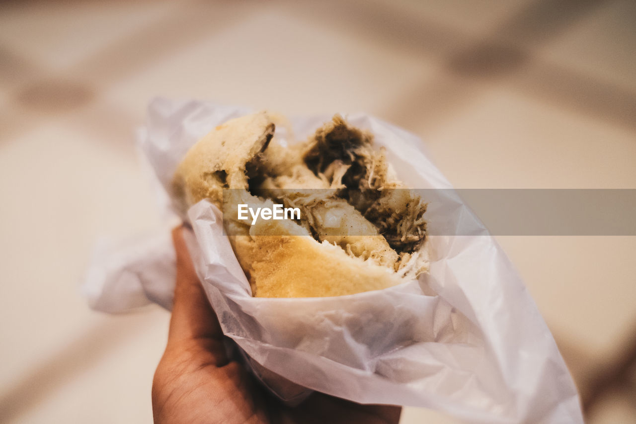 Close-up of hand holding food