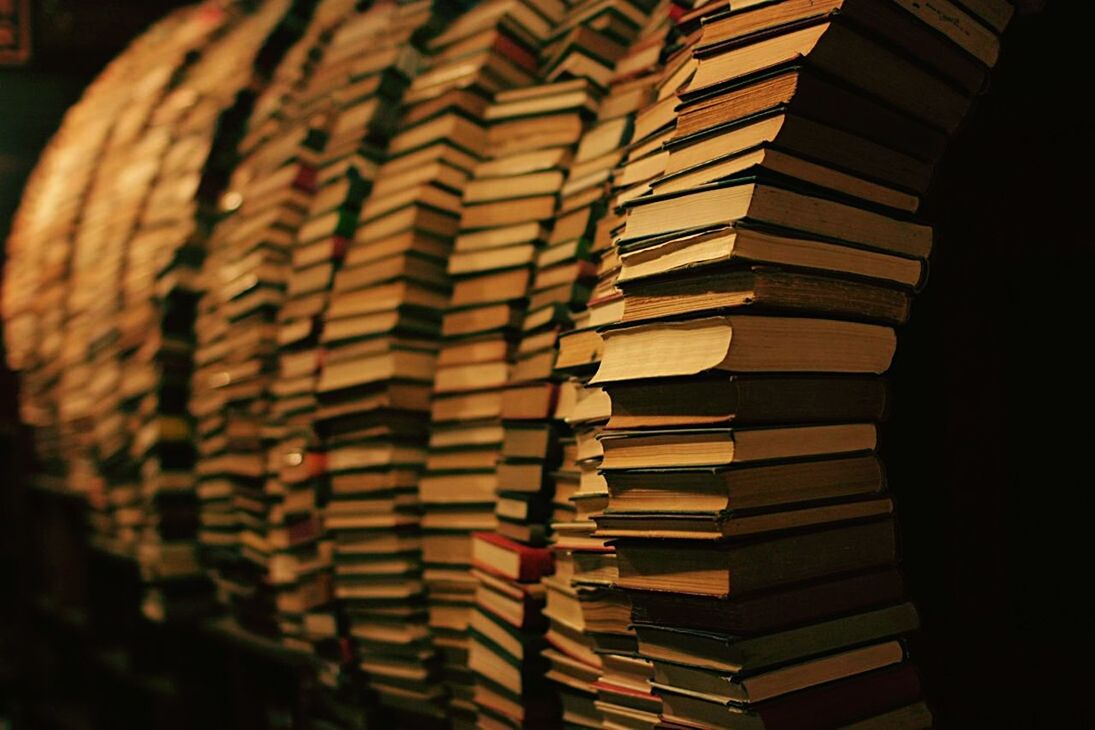 indoors, large group of objects, no people, stack, selective focus, pattern, still life, close-up, arrangement, abundance, in a row, full frame, backgrounds, sunlight, hanging, shadow, focus on foreground, paper, belief