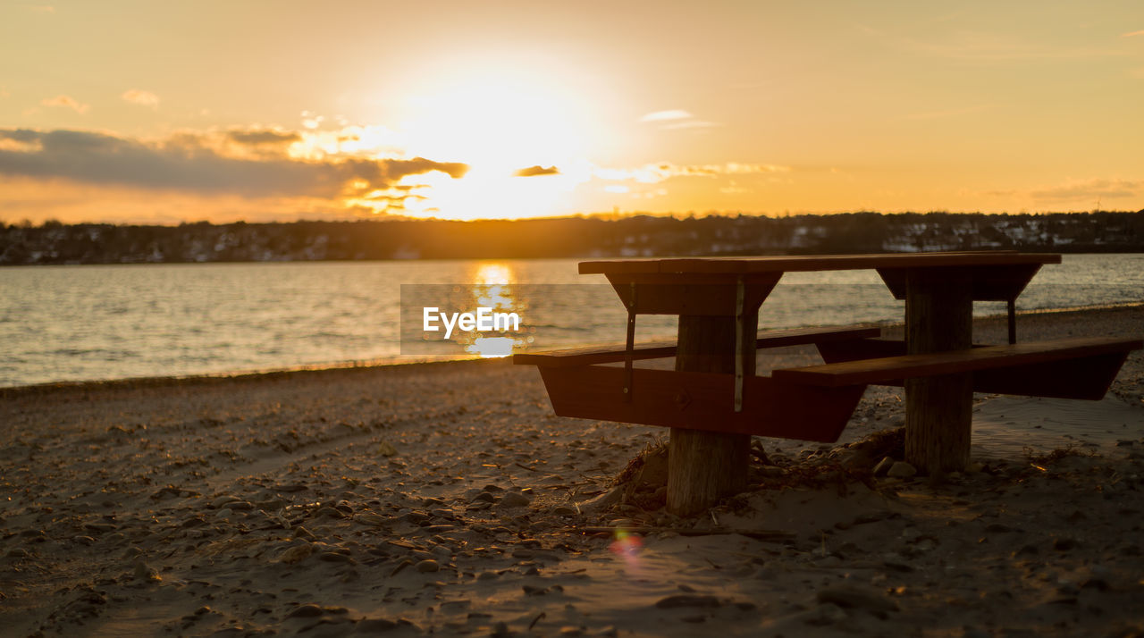 Scenic view of beach against sky during sunset