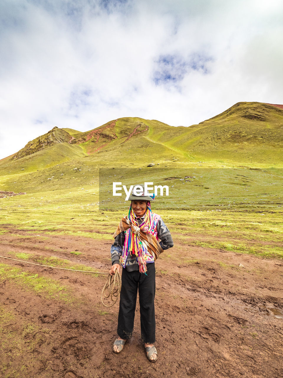 FULL LENGTH OF MAN STANDING ON MOUNTAIN