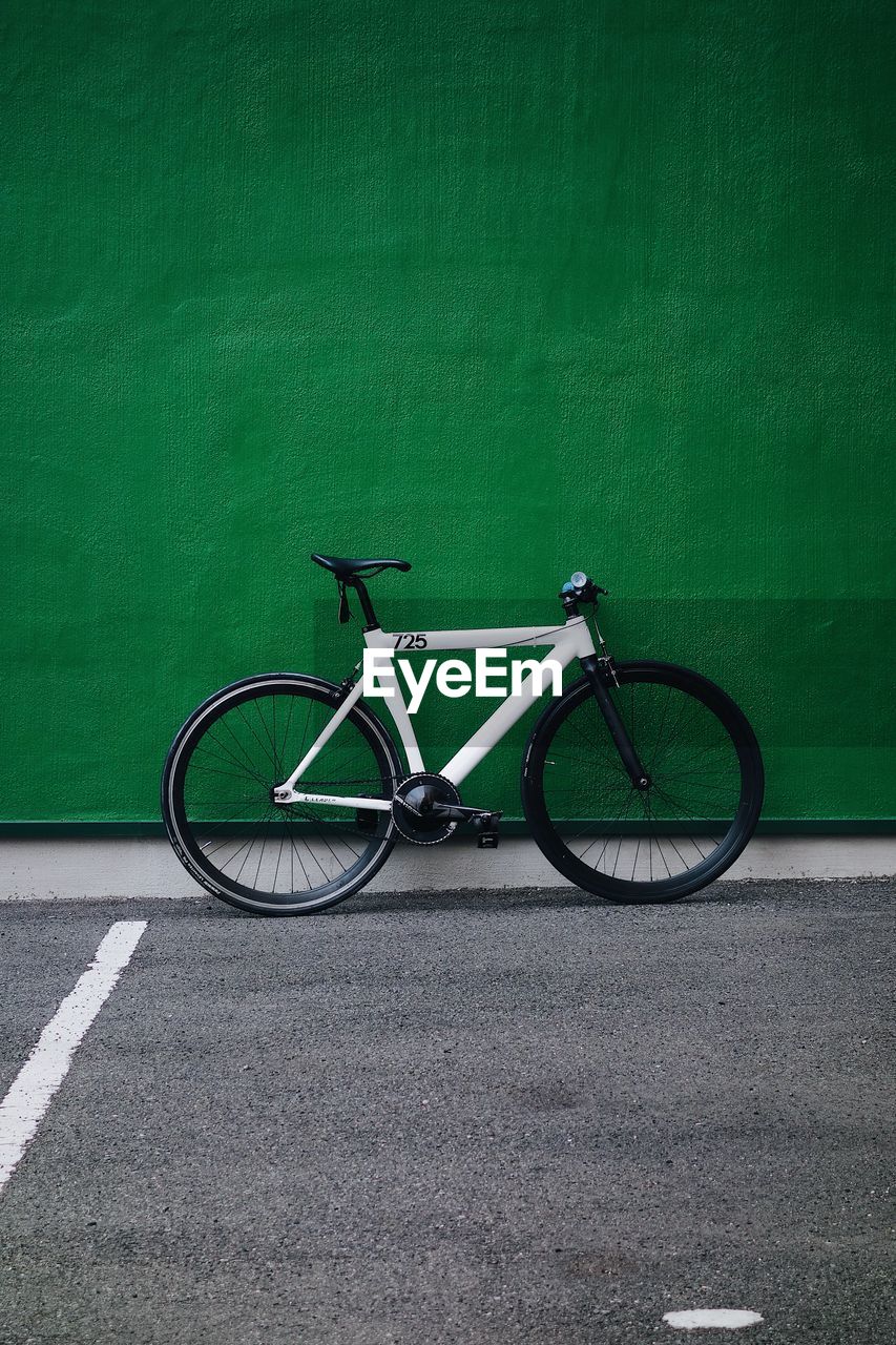 BICYCLE PARKED ON WALL