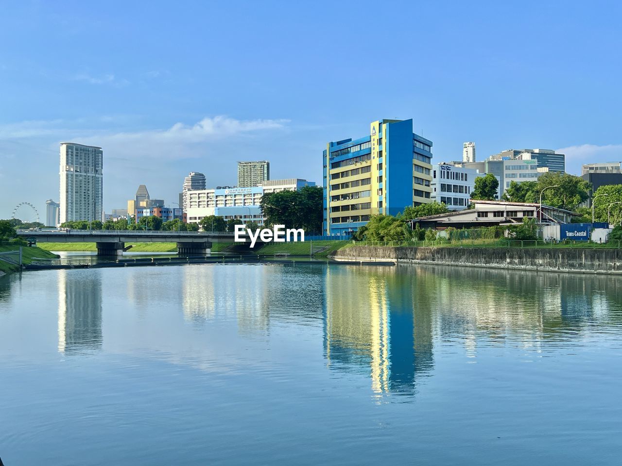 architecture, built structure, building exterior, water, city, building, reflection, sky, skyline, office building exterior, skyscraper, cityscape, nature, landscape, waterfront, residential district, blue, urban skyline, travel destinations, river, no people, office, horizon, outdoors, day, urban area, city life, downtown district, tree, travel, tower block, landmark, business, downtown, clear sky, plant