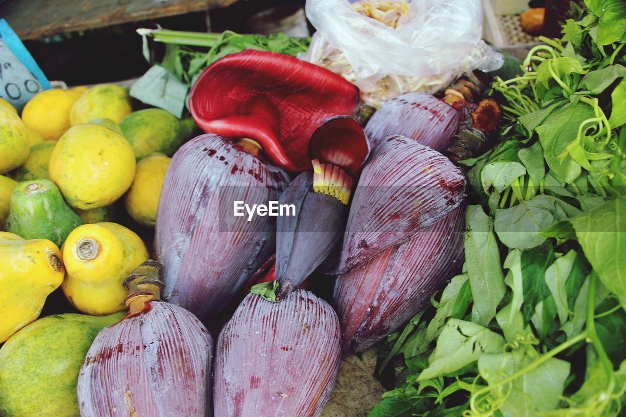 High angle view of banana flower and fruits for sale at market stall