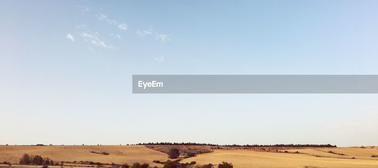 Scenic view of desert against clear sky