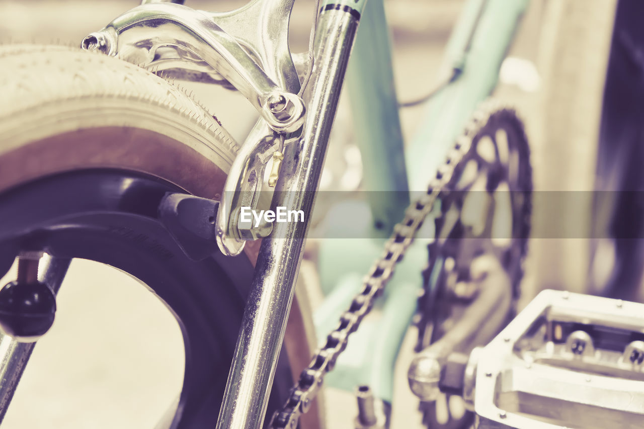 Close-up of bicycle wheel on road