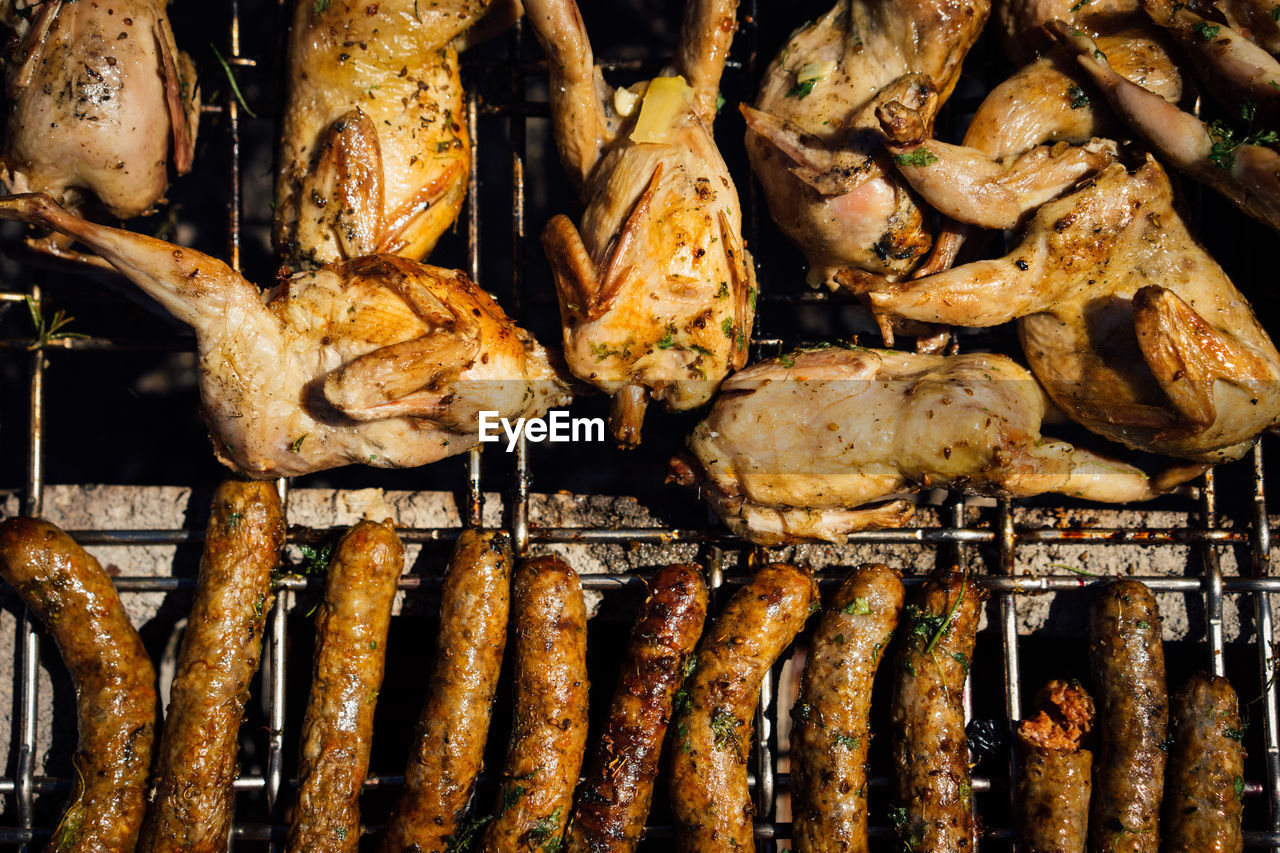 Directly above shot of meat on barbecue grill