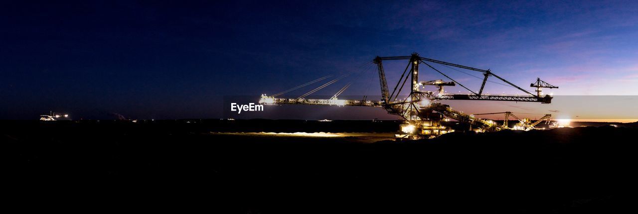 View of gigantic excavator at night