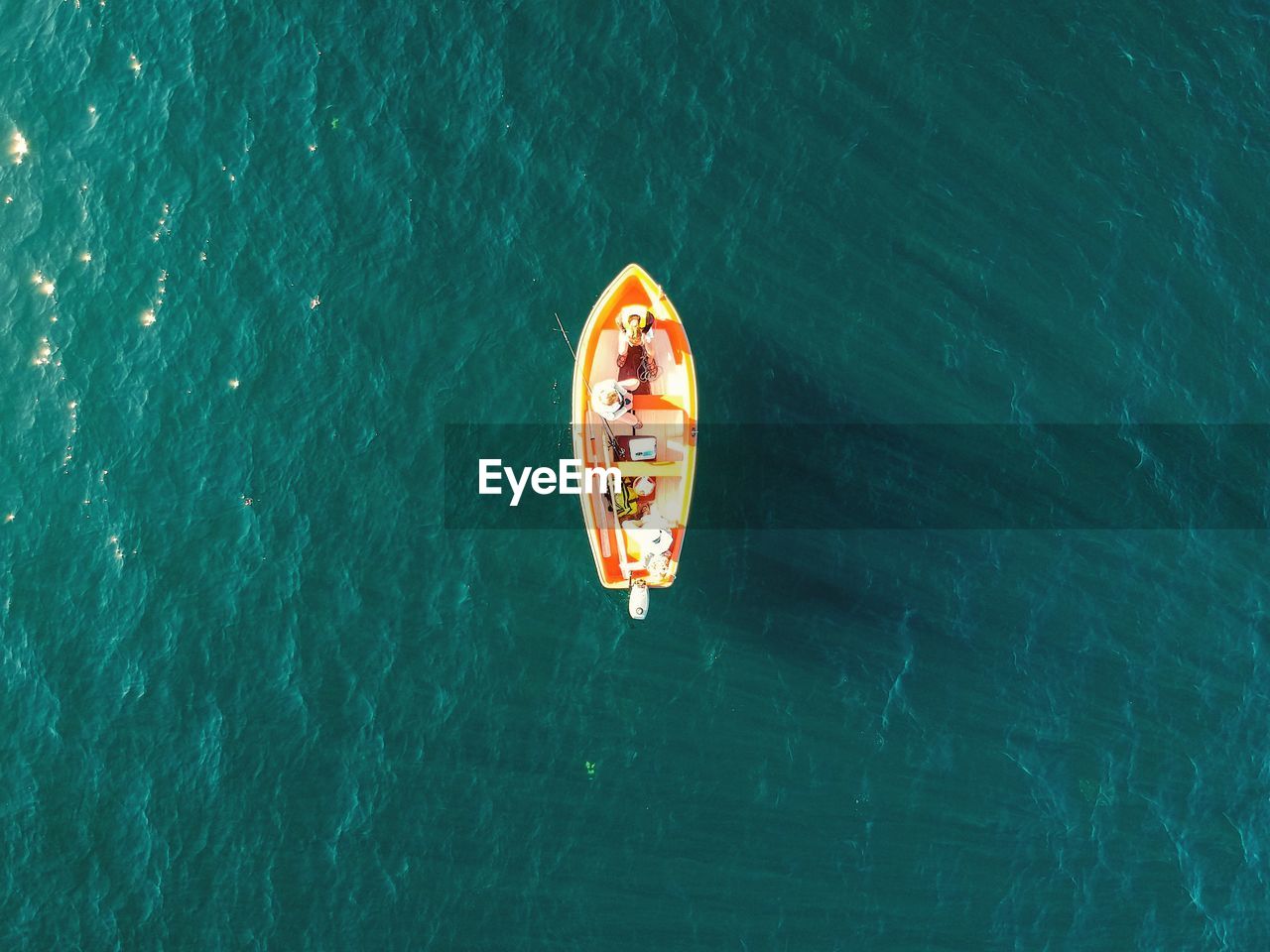 Aerial view of a lonely rowboat at sea