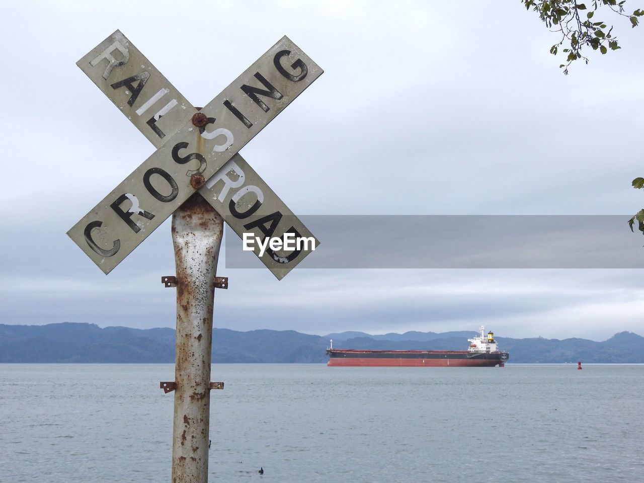 INFORMATION SIGN ON SEA AGAINST SKY