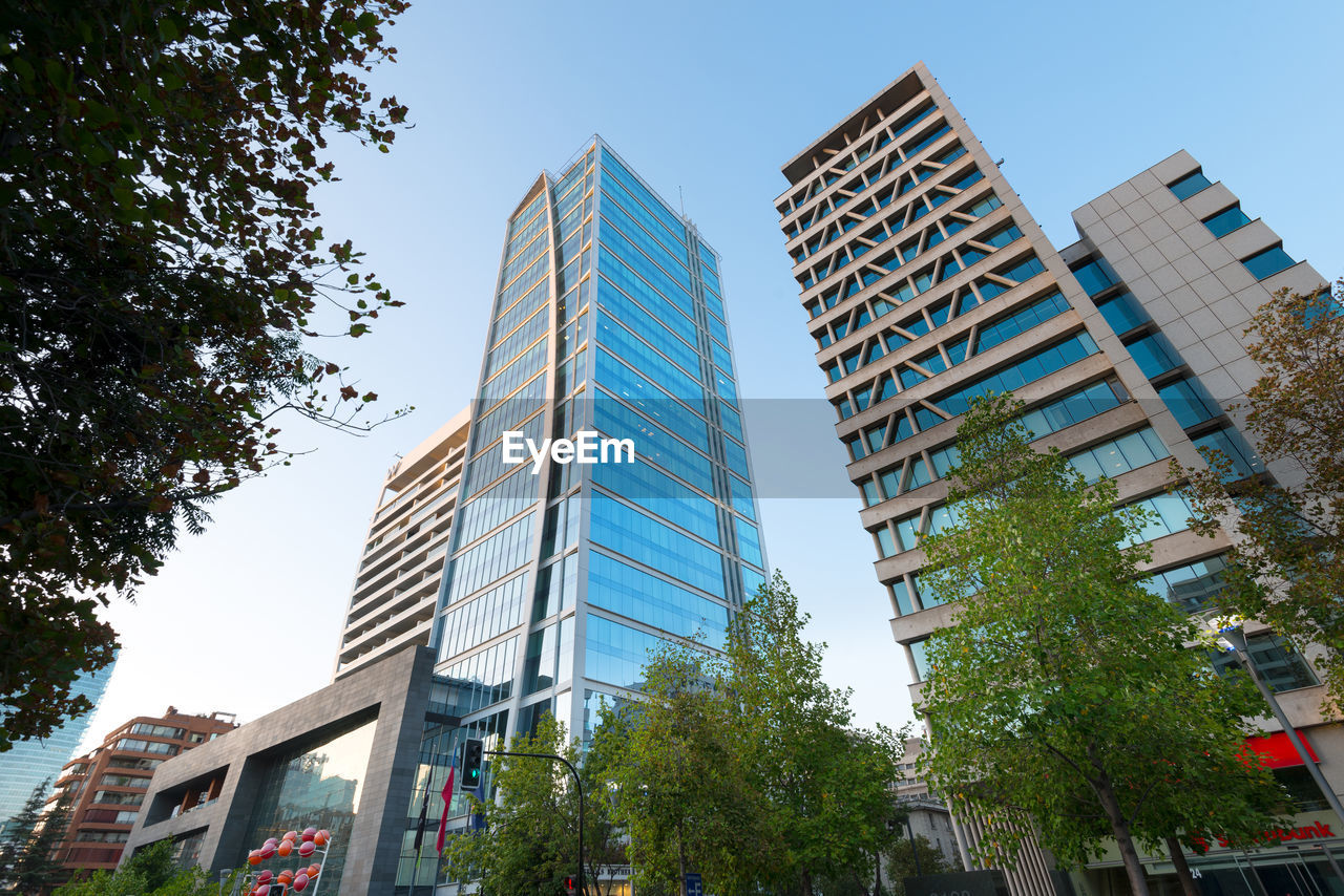 LOW ANGLE VIEW OF BUILDINGS AGAINST SKY