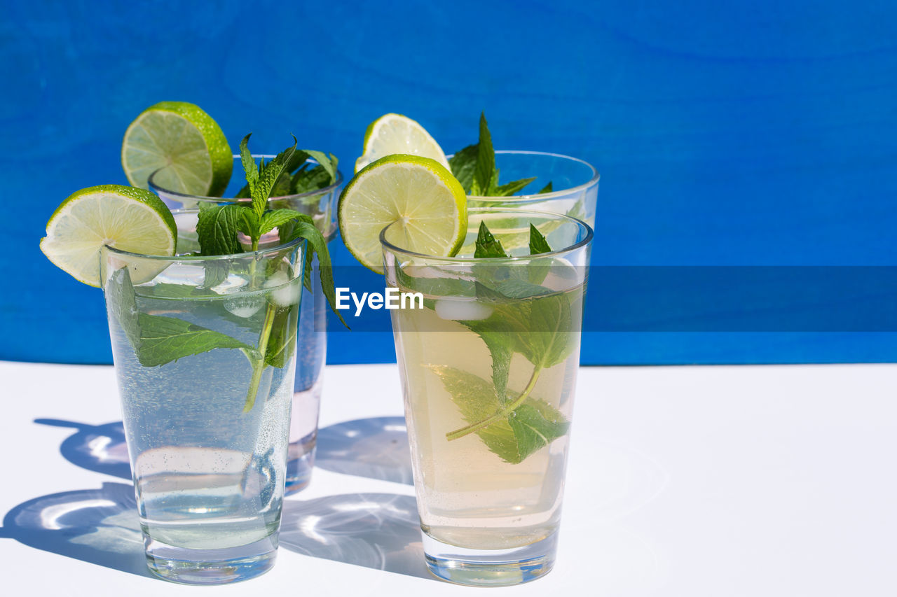 Close-up of four glasses of mojito