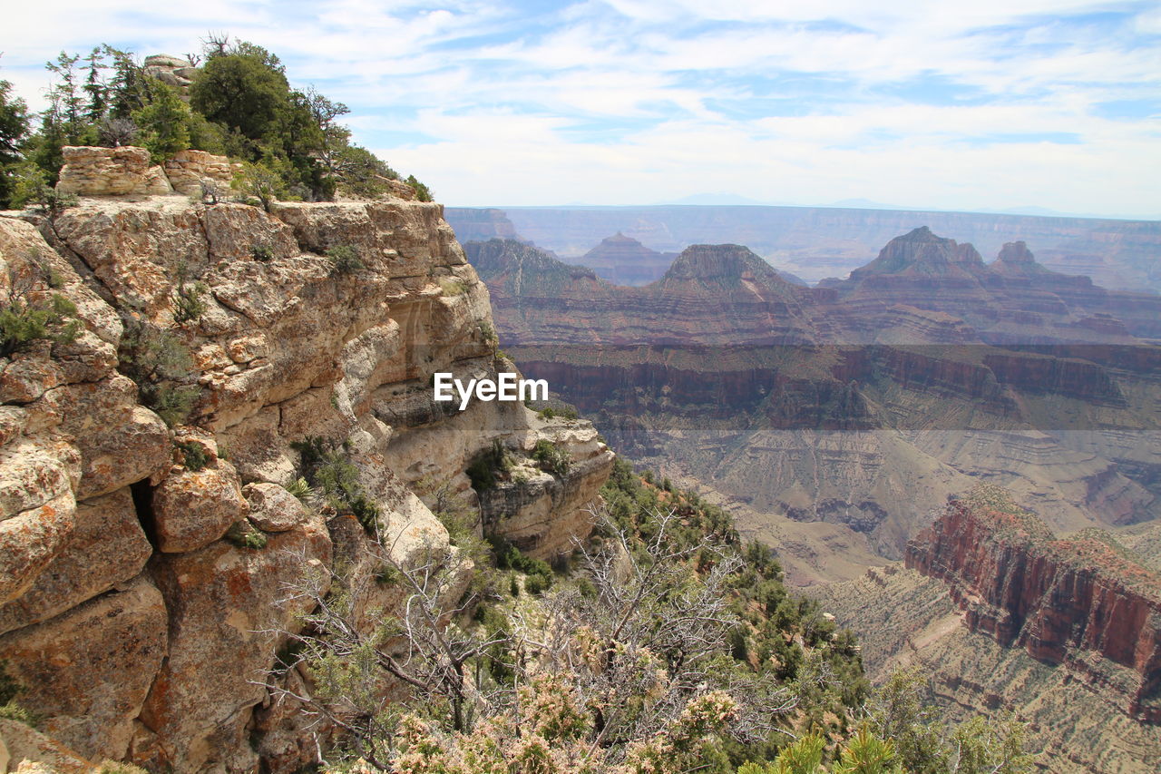 Rock formations on landscape against sky