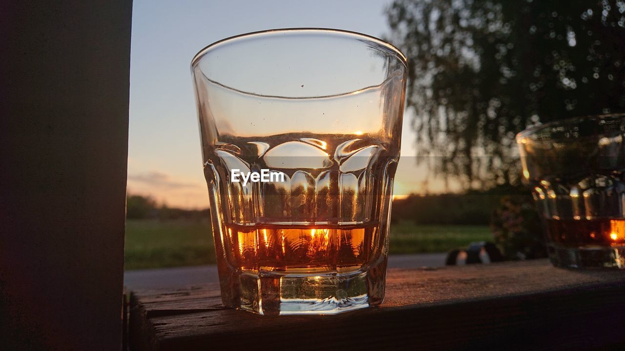 Close-up of glass whith whiskey on table