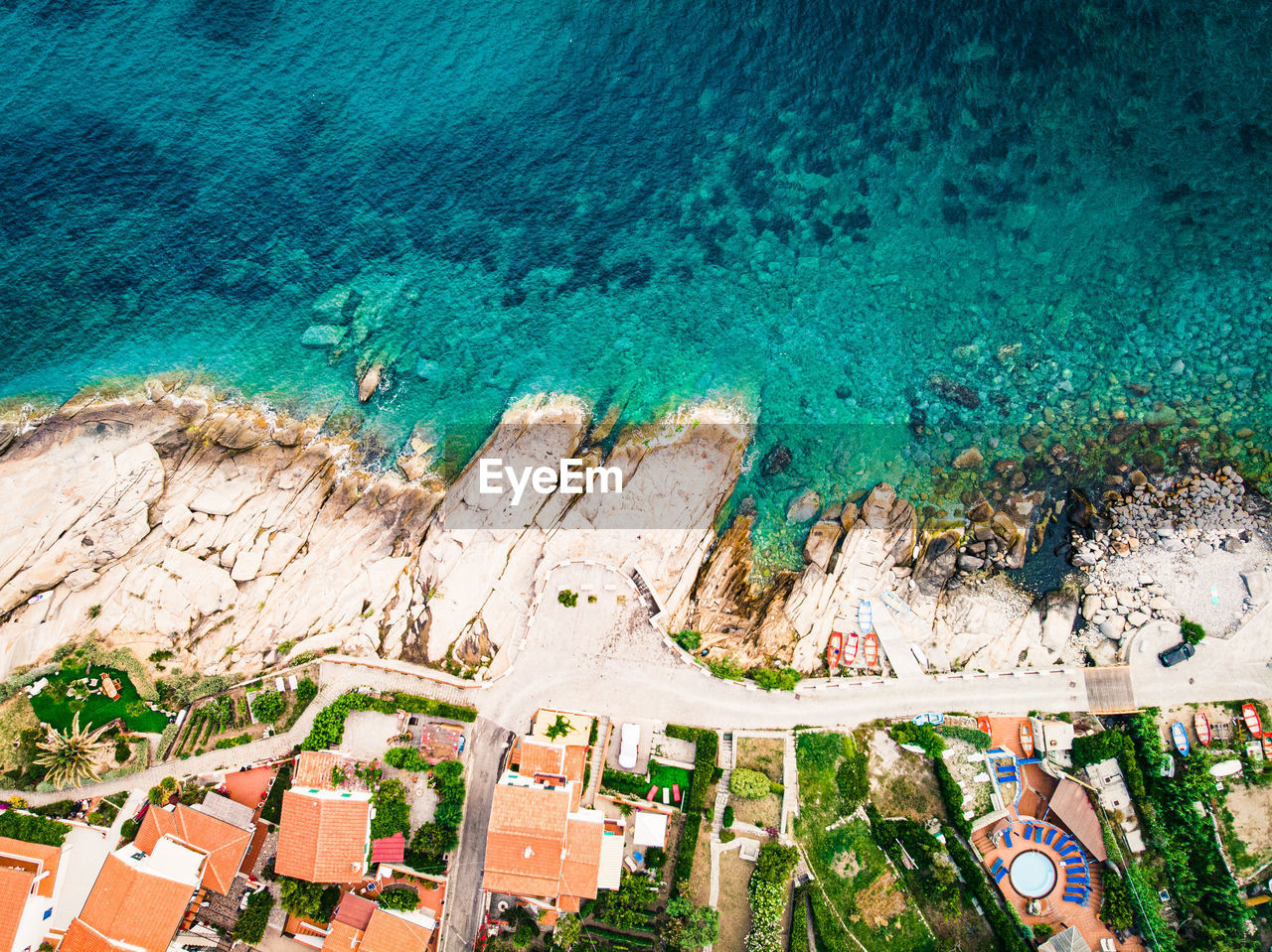 Aerial view of houses by seashore