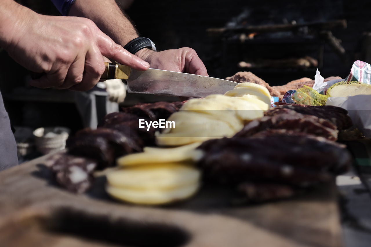 Midsection of person preparing food