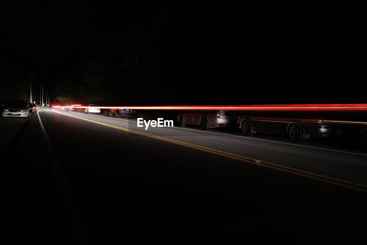 Light trails on road at night