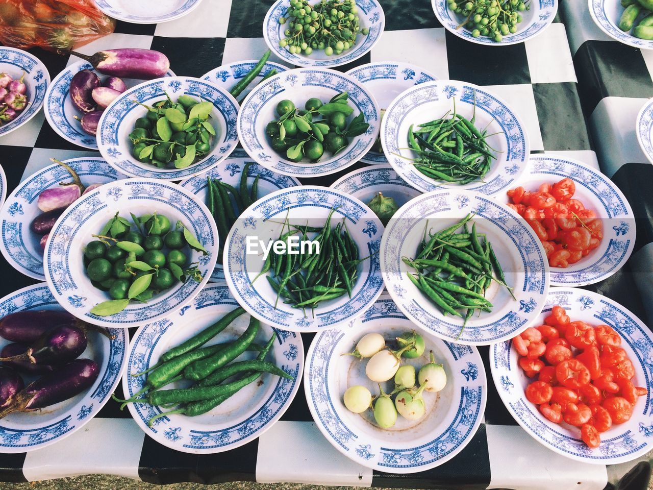 High angle view of vegetables in plate for sale at market