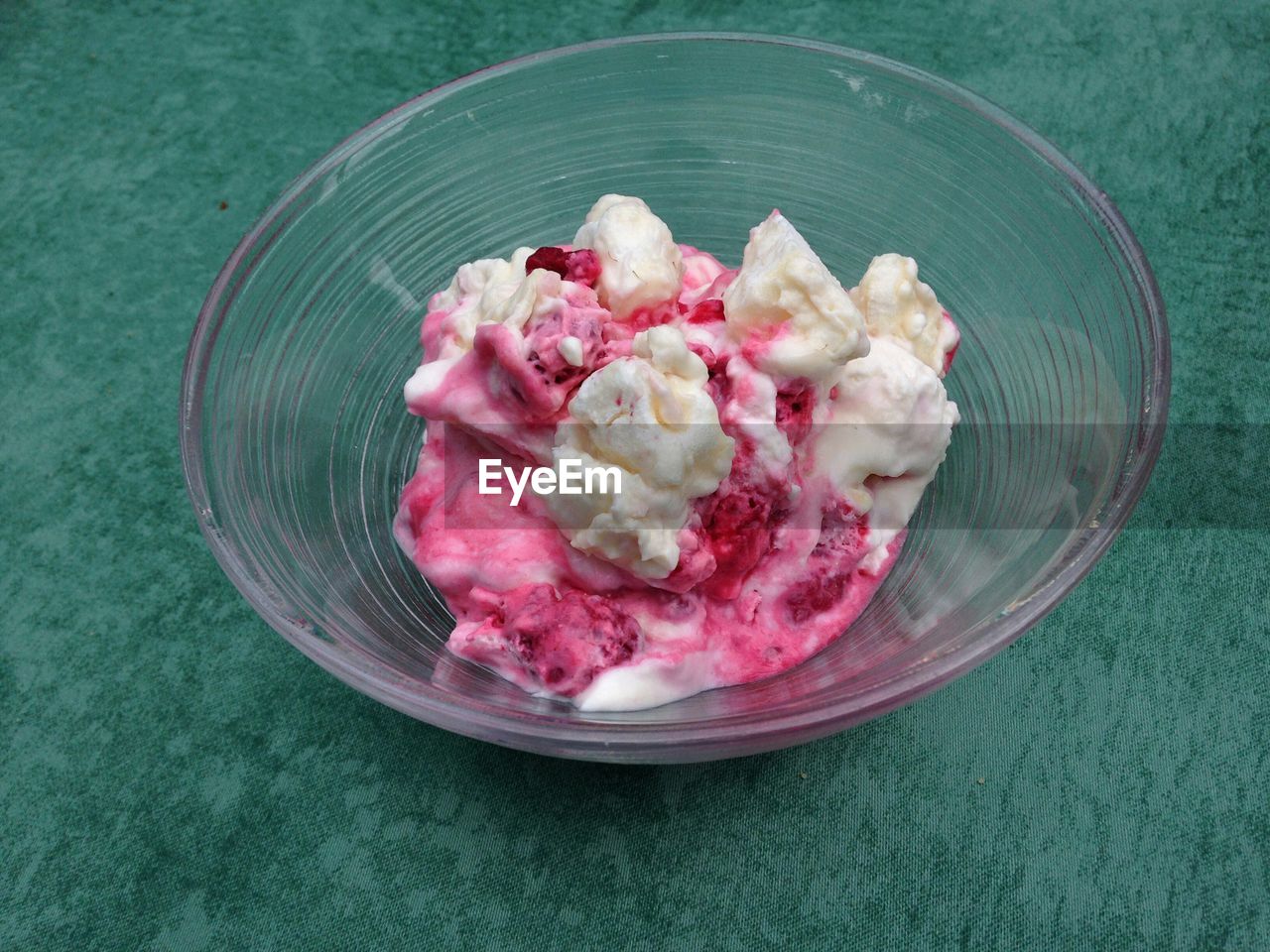 High angle view of raspberry ice cream in bowl on table