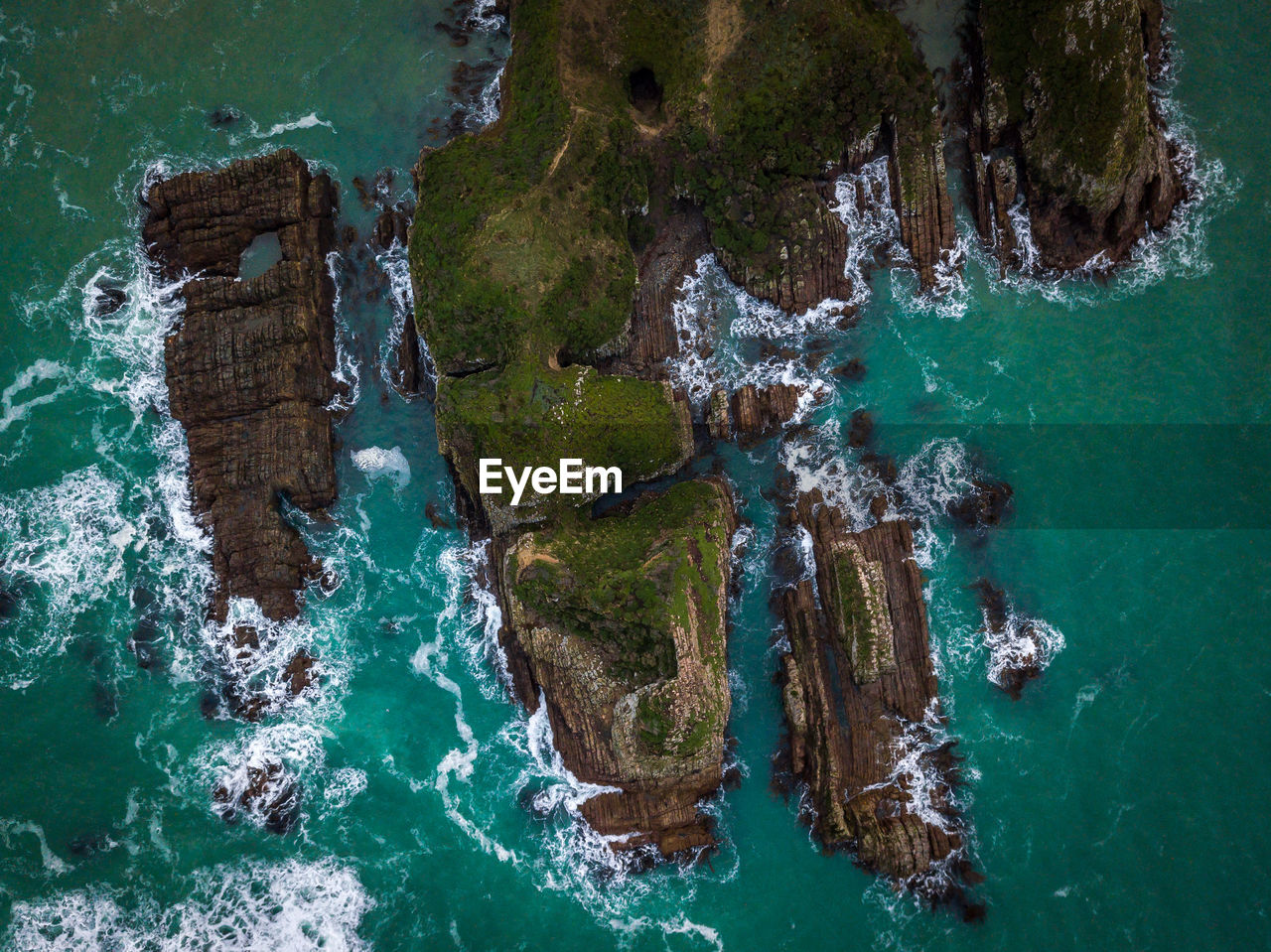 High angle view of rocks by sea