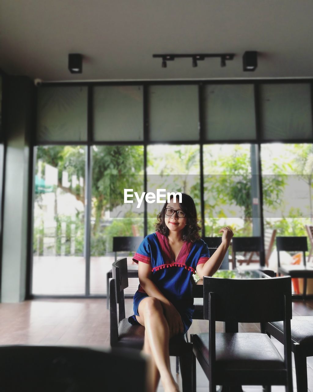 Portrait of businesswoman sitting on chair in office