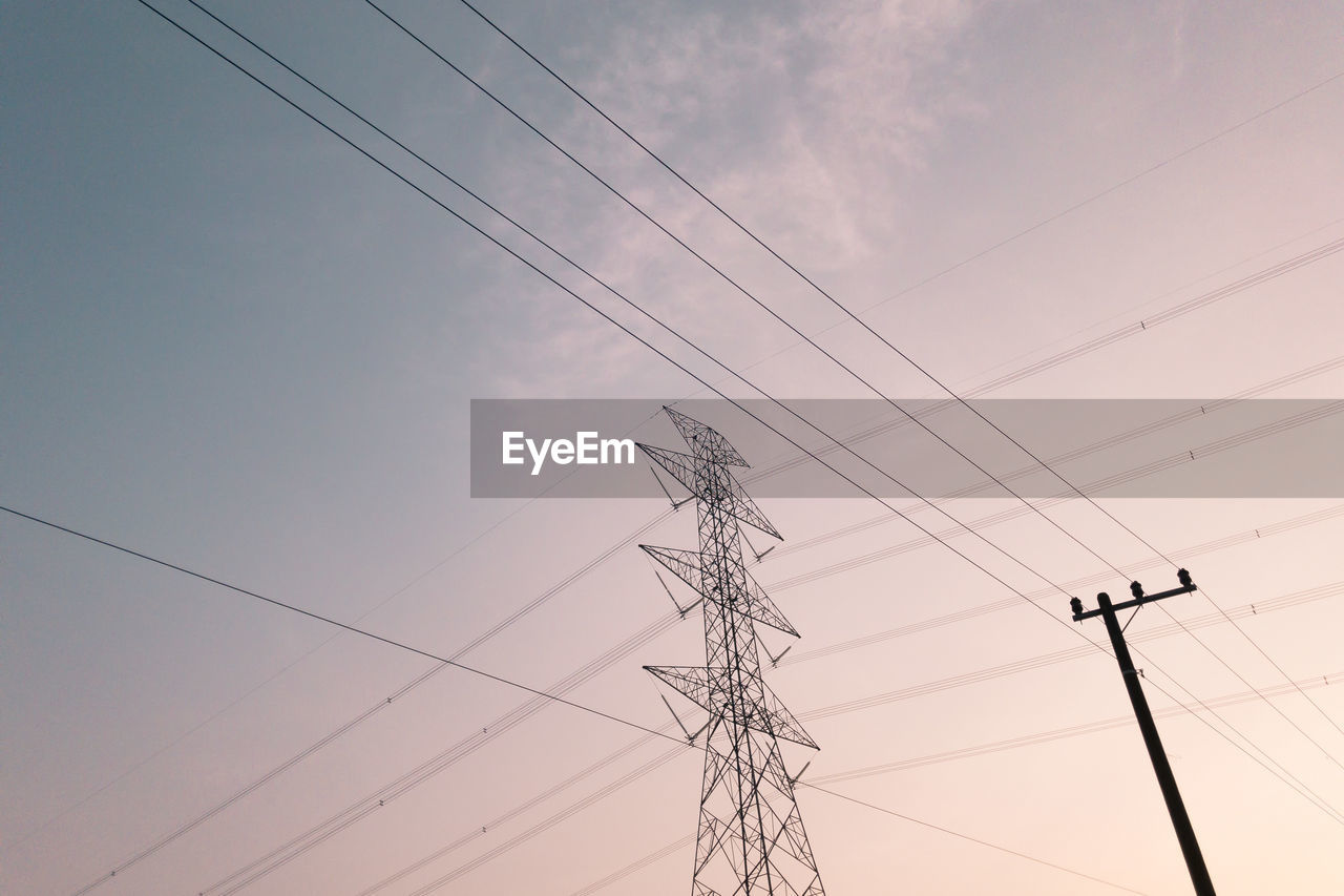 Low angle view of power lines against sky