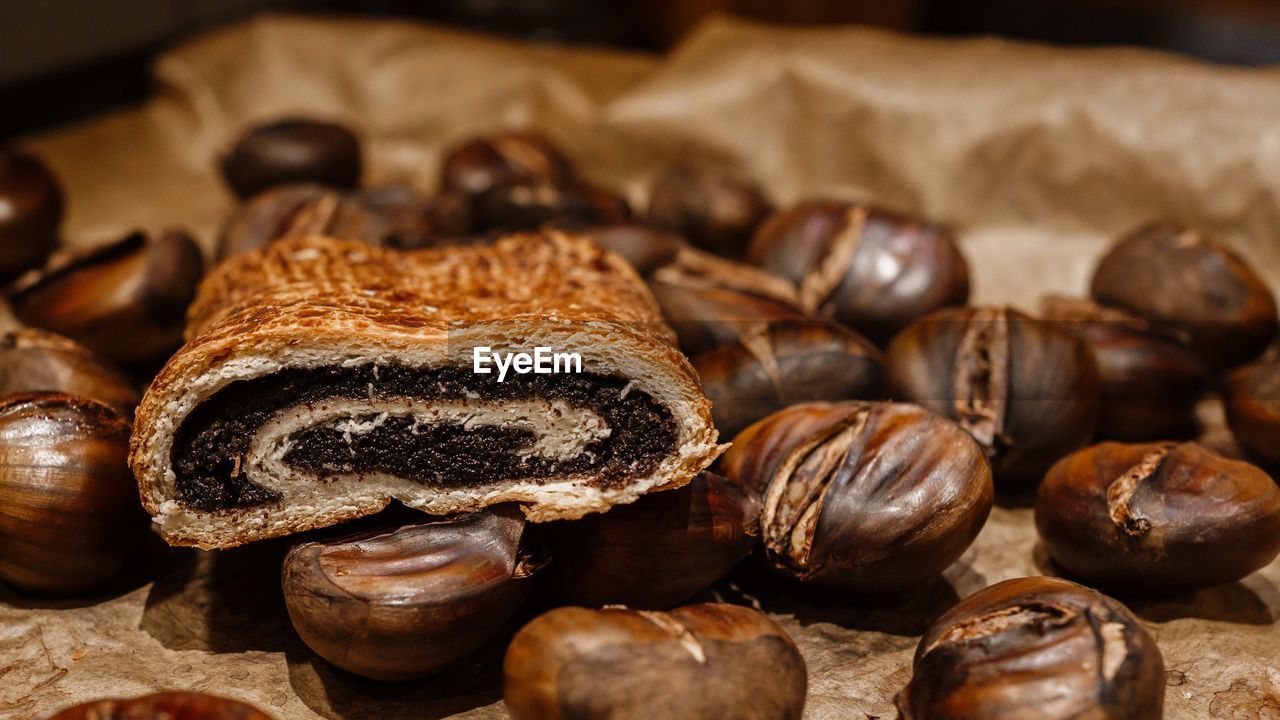 food and drink, food, freshness, close-up, brown, produce, no people, indoors, large group of objects, wellbeing, healthy eating, abundance, still life, chocolate, chestnut, nut, coffee, nuts & seeds, nut - food, dessert, focus on foreground, bread, roasted coffee bean