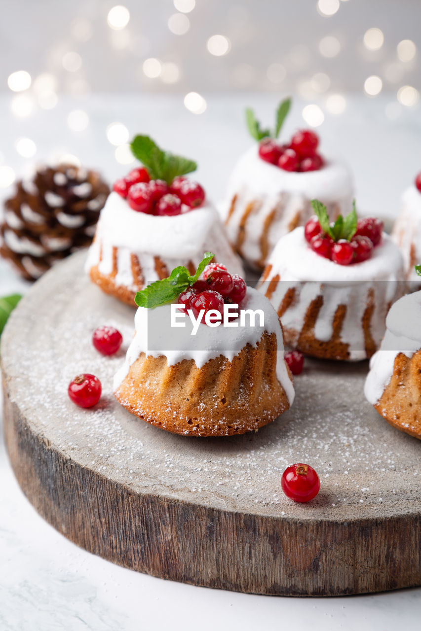 High angle view of christmas muffins with pine cones on table