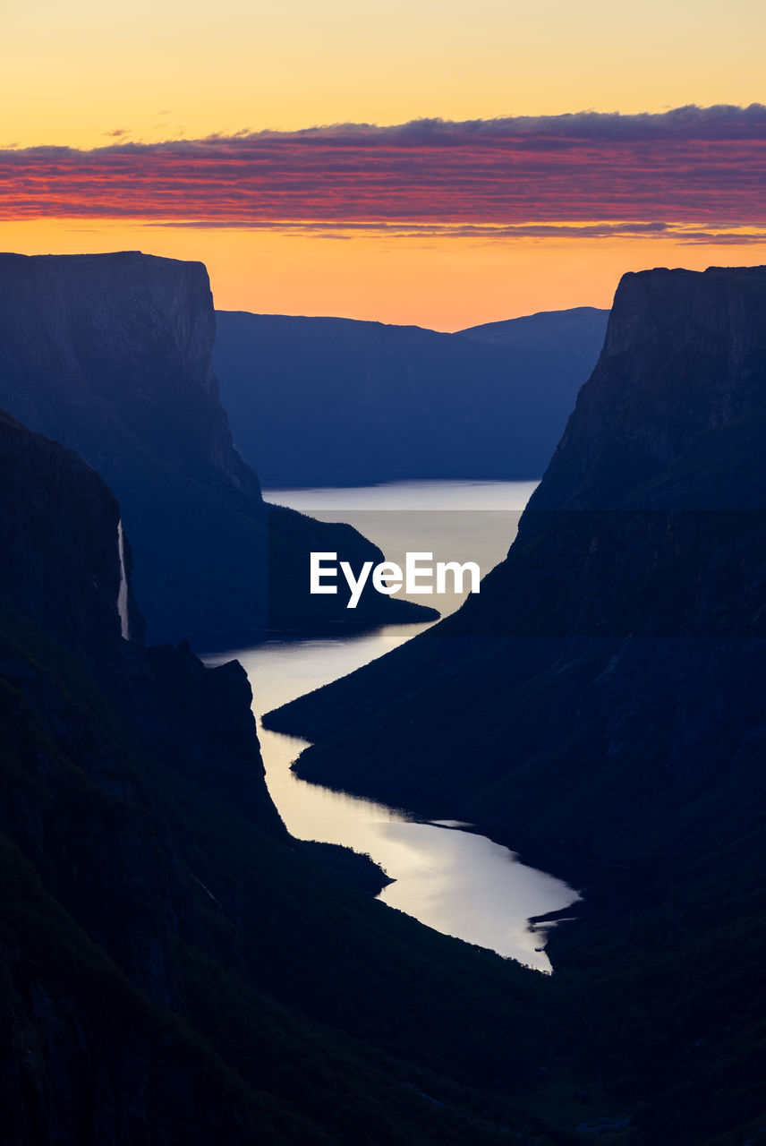 Scenic view of sea against sky during sunset in gros morne national park, newfoundland, canada