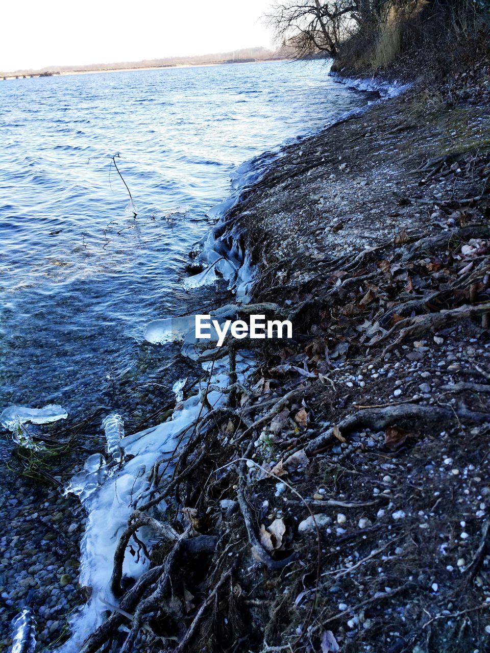 CLOSE-UP OF SNOW ON SEA SHORE