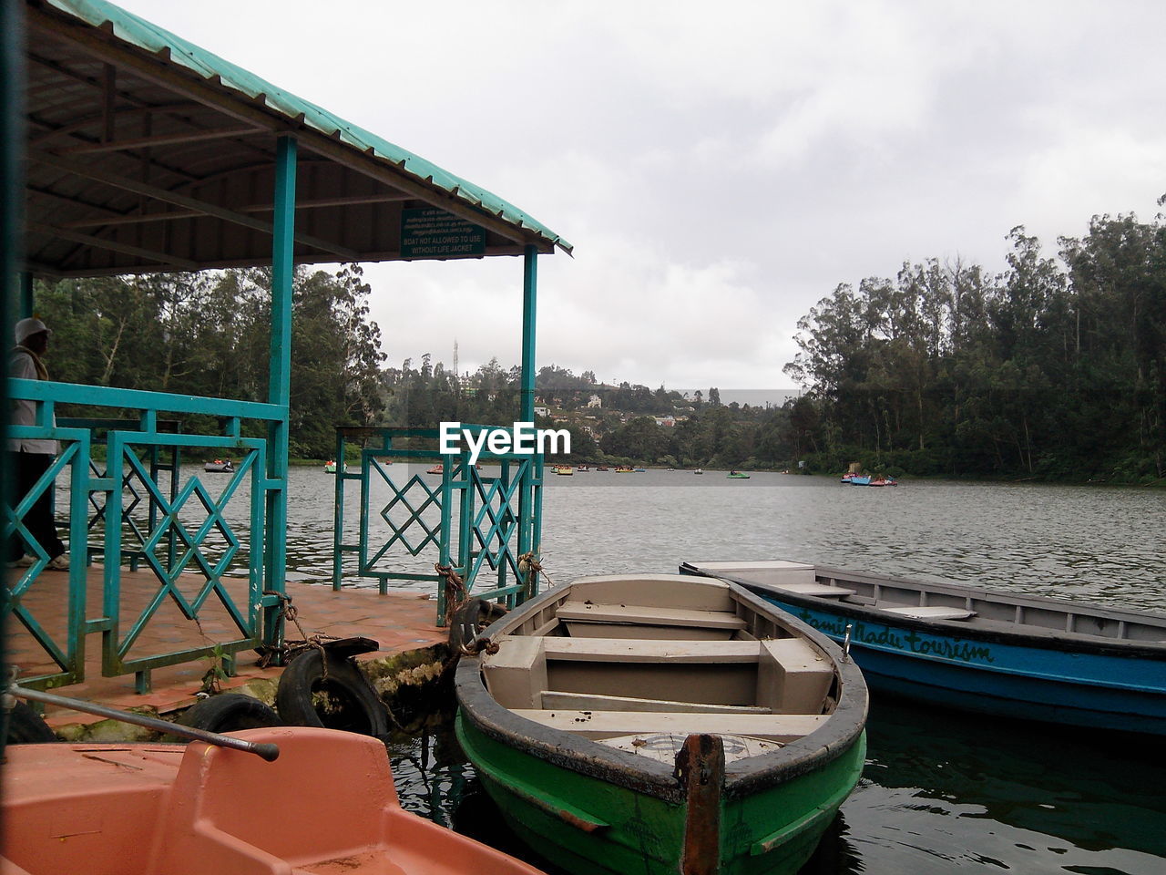 Boats moored in river