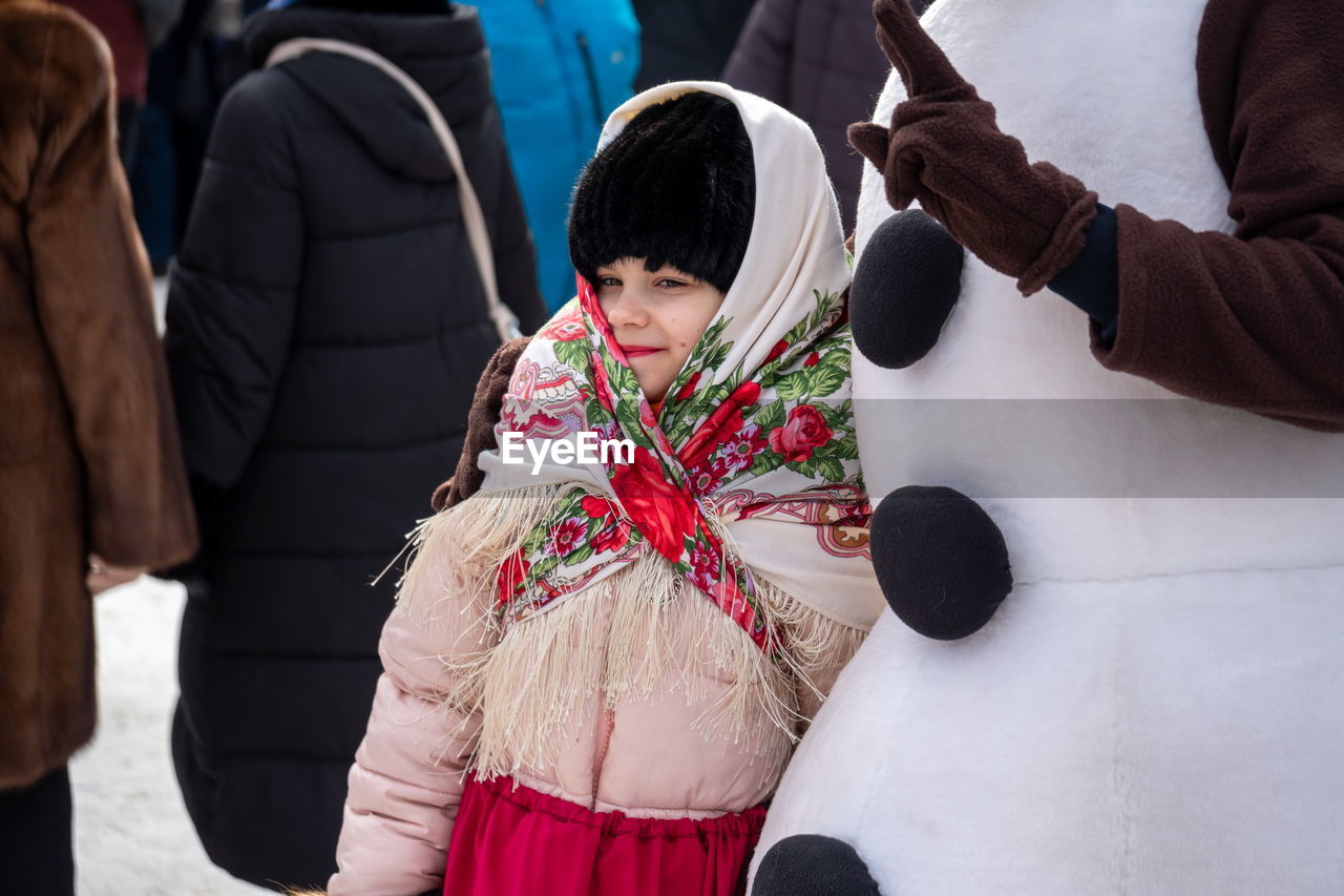 adult, women, clothing, winter, group of people, warm clothing, men, togetherness, female, costume, child, red, young adult, childhood, person, outdoors, day, lifestyles