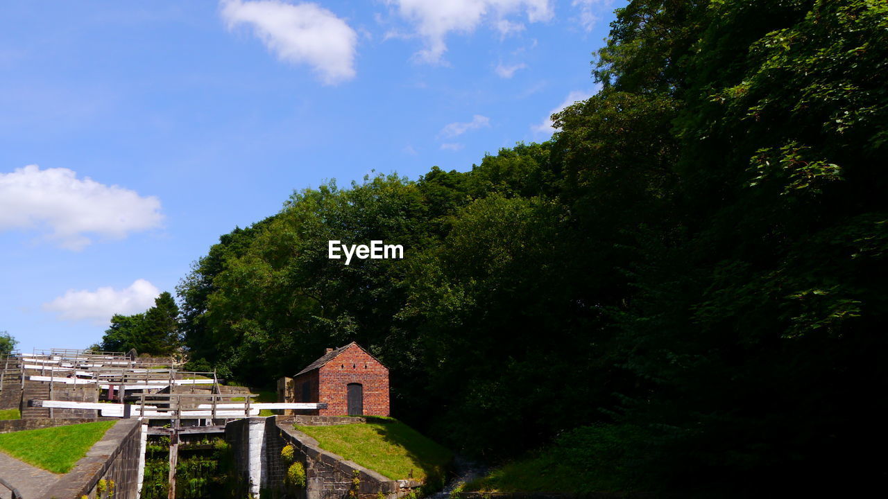 Bingley five rise locks against a backdrop of trees and sky