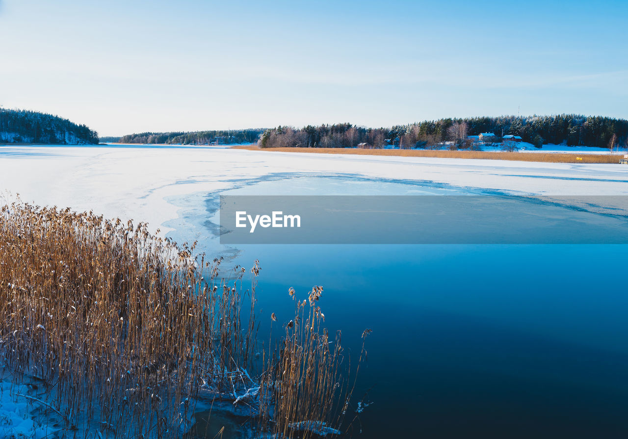 Scenic view of sea against sky during winter
