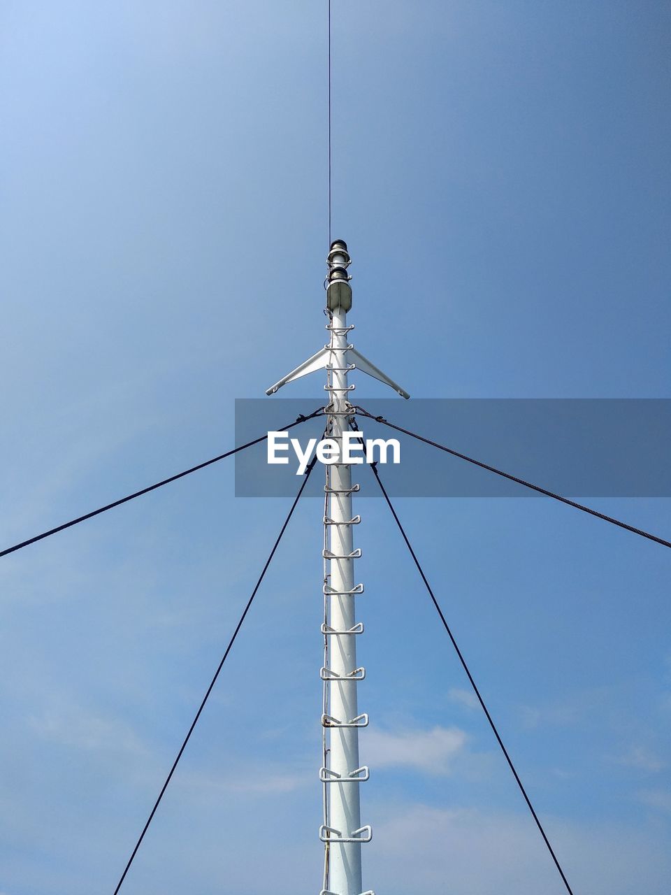 LOW ANGLE VIEW OF TELEPHONE POLE AGAINST CLEAR SKY