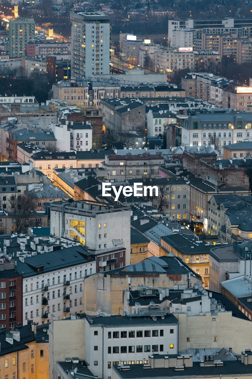 High angle view of buildings in city during sunset