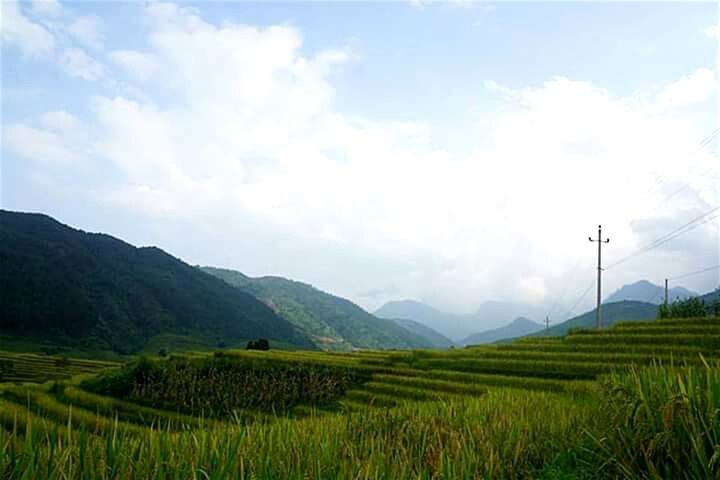 SCENIC VIEW OF MOUNTAINS AGAINST CLOUDY SKY