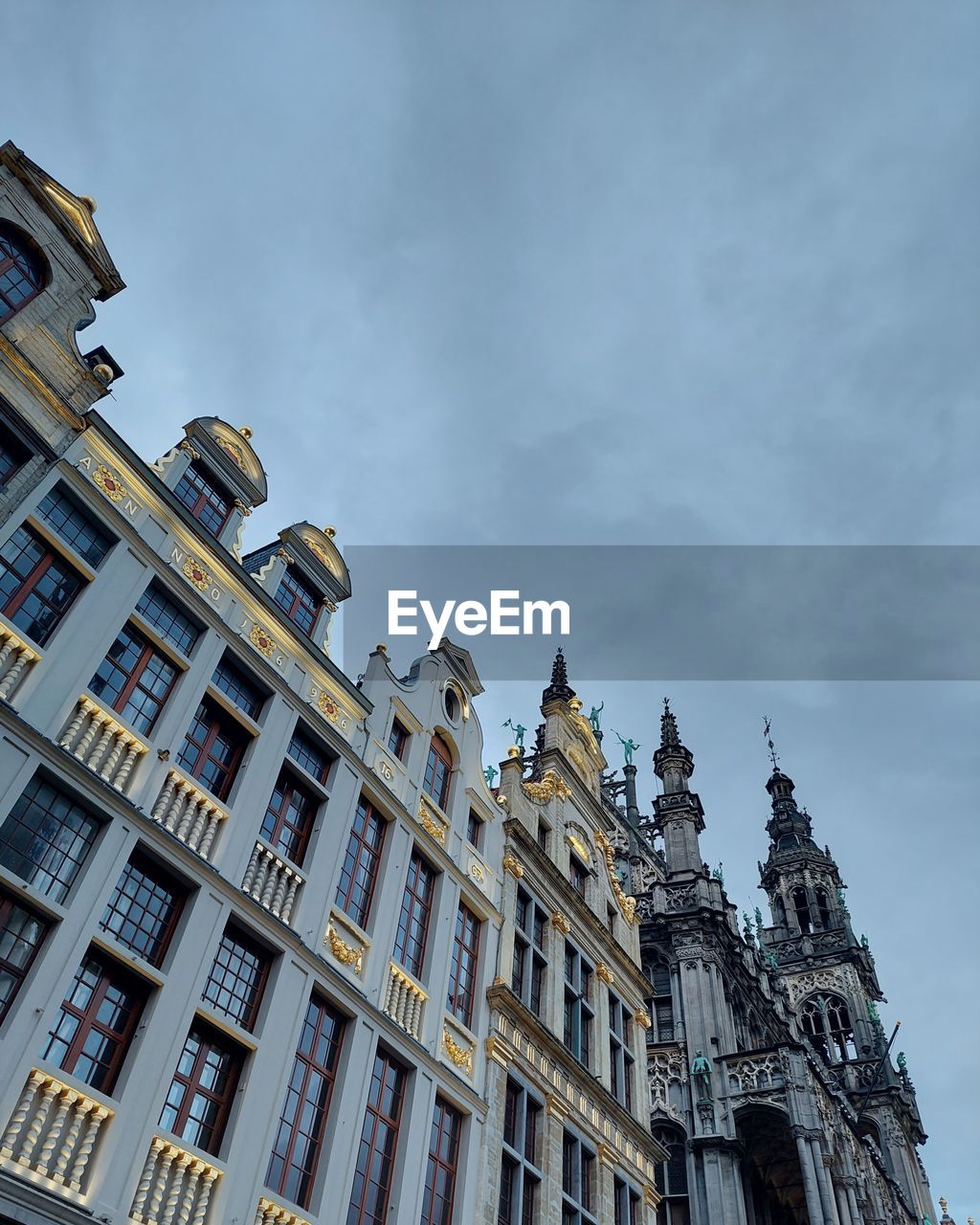 architecture, building exterior, built structure, building, sky, city, landmark, cityscape, urban area, low angle view, travel destinations, facade, the past, history, metropolis, nature, cloud, no people, travel, skyscraper, window, residential district, business finance and industry, tourism, outdoors, construction industry, mansion, tower, industry, downtown, old