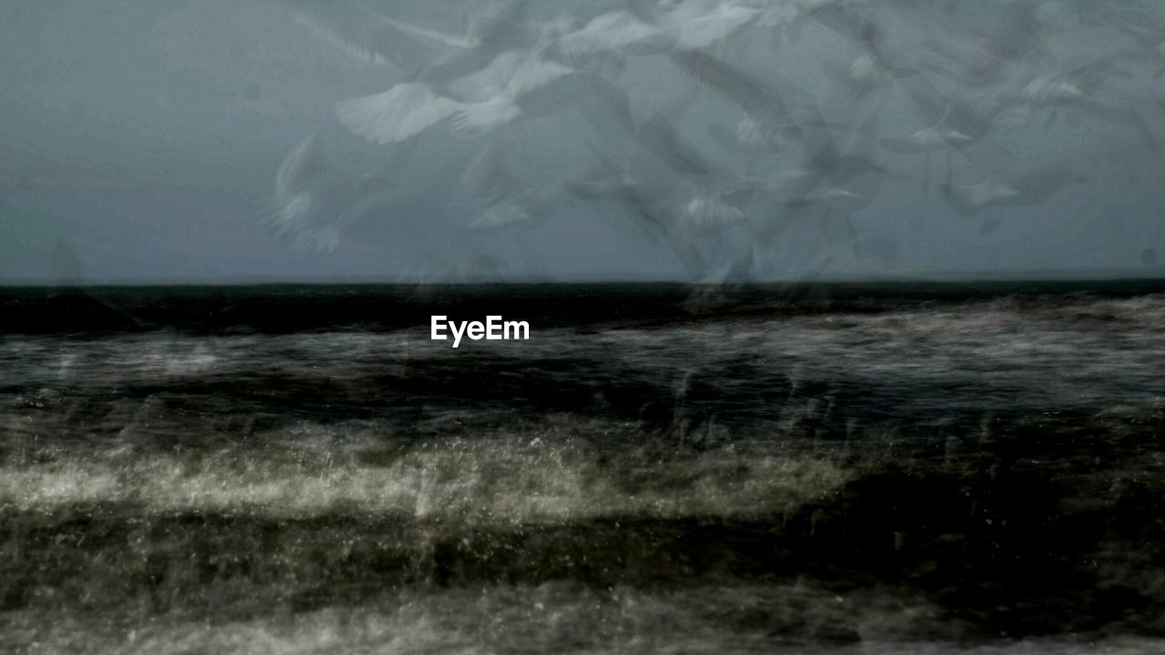 WAVES SPLASHING ON SHORE