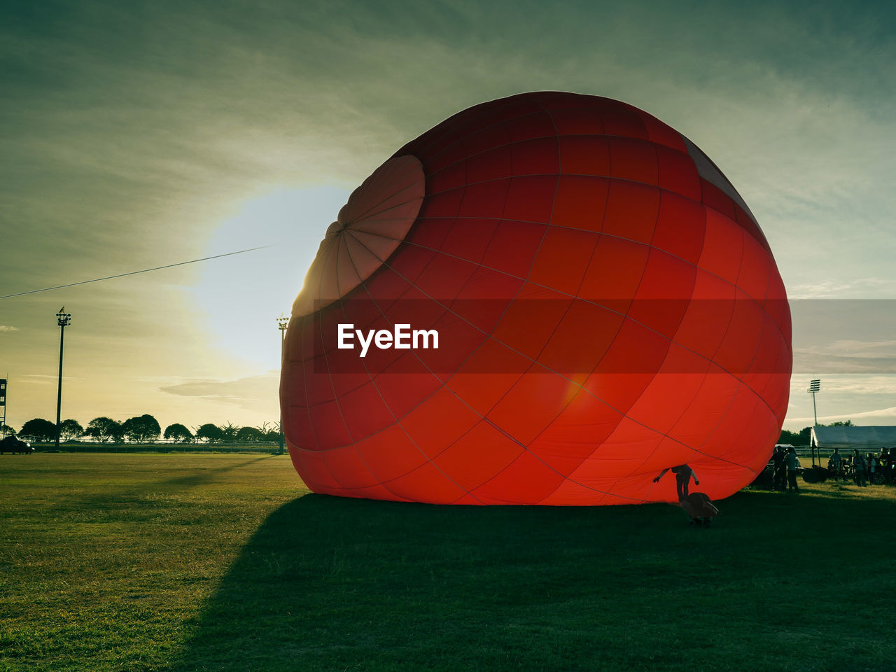 HOT AIR BALLOON FLYING OVER LAND