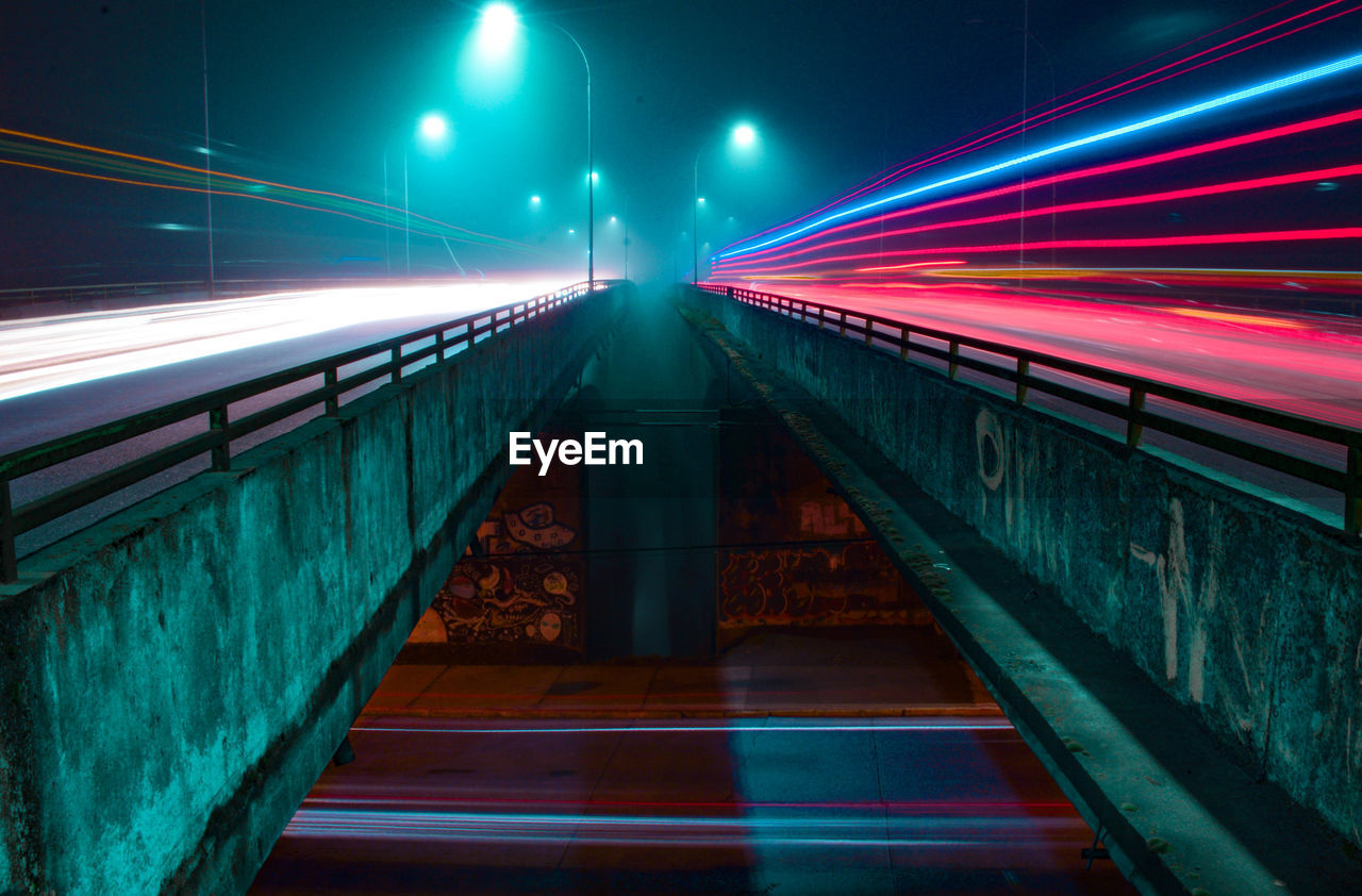 Light trails on illuminated city at night