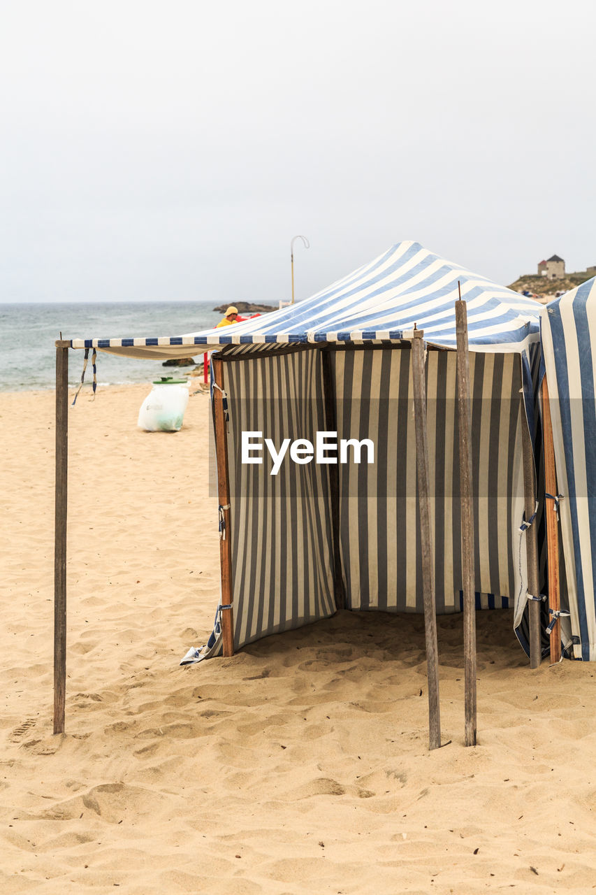 HOODED CHAIRS ON BEACH