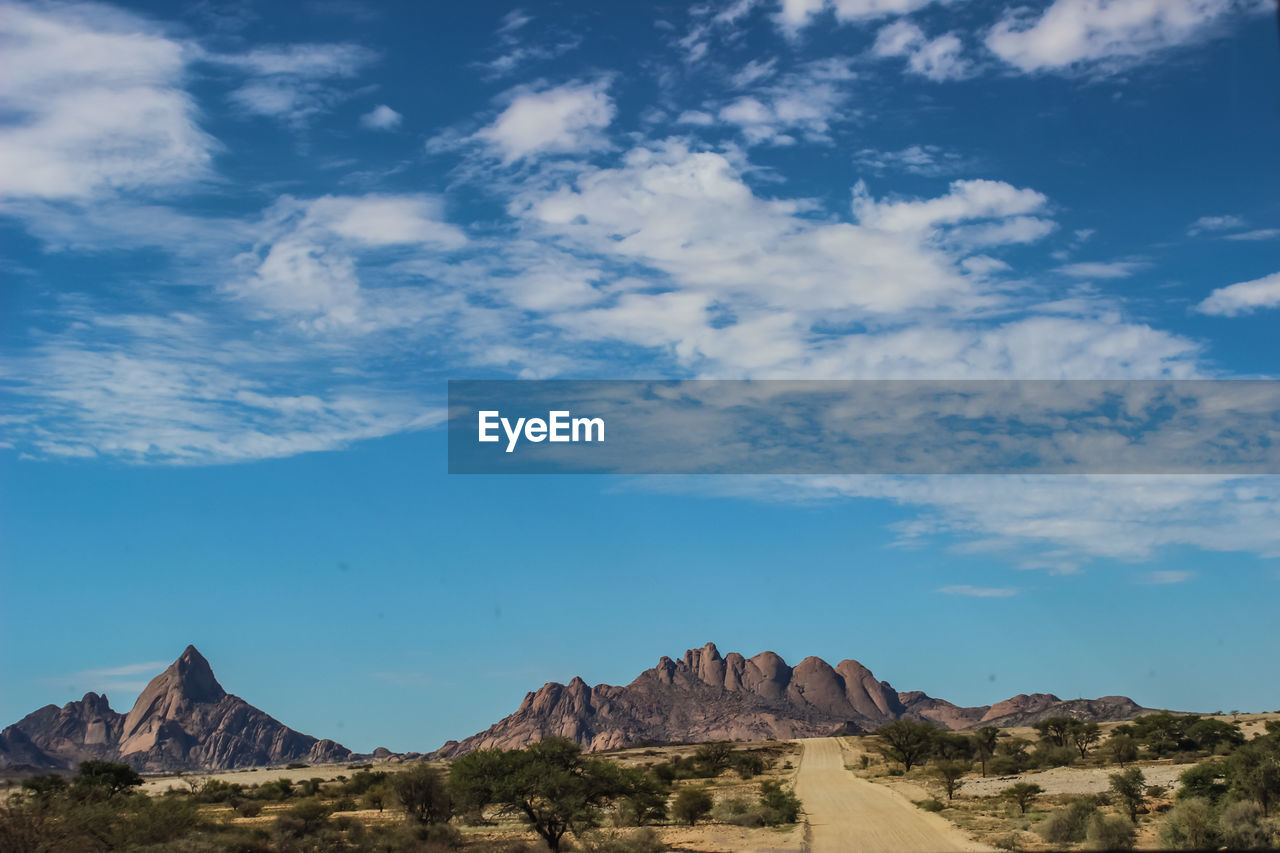 Panoramic view of landscape against cloudy sky