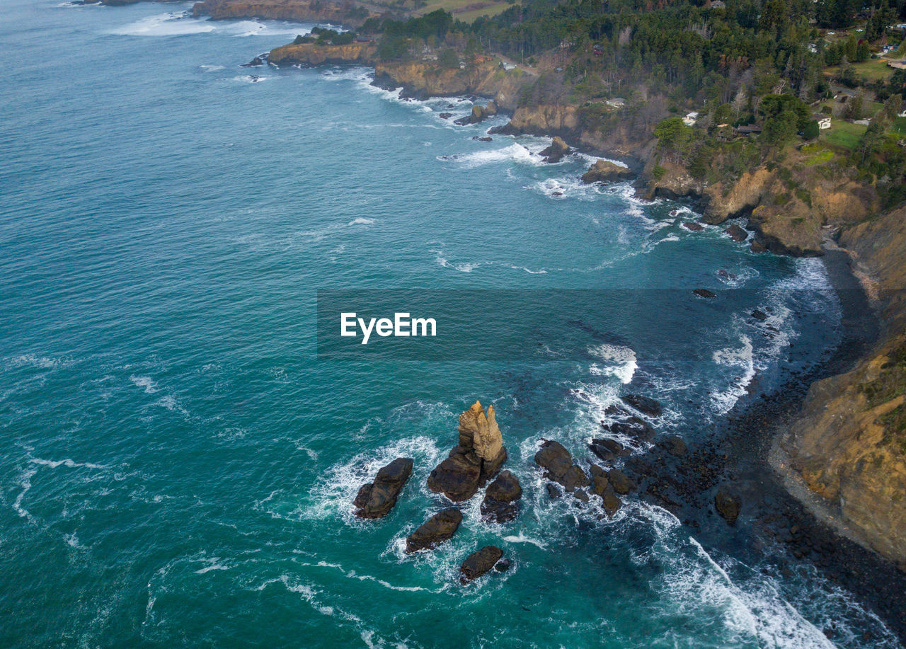 High angle view of rocks in sea