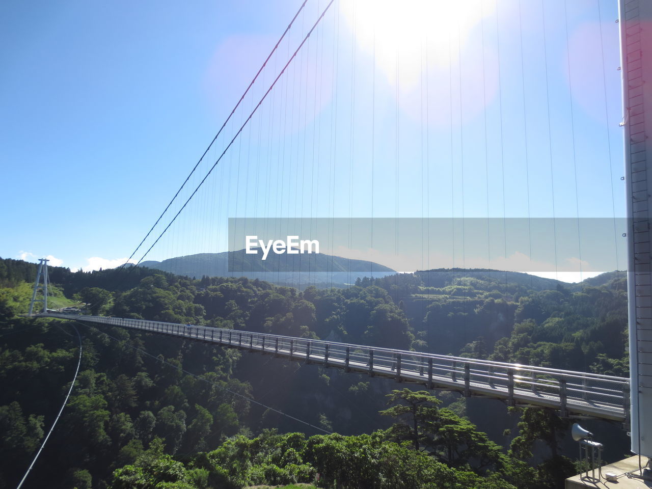 Scenic view of mountains against blue sky