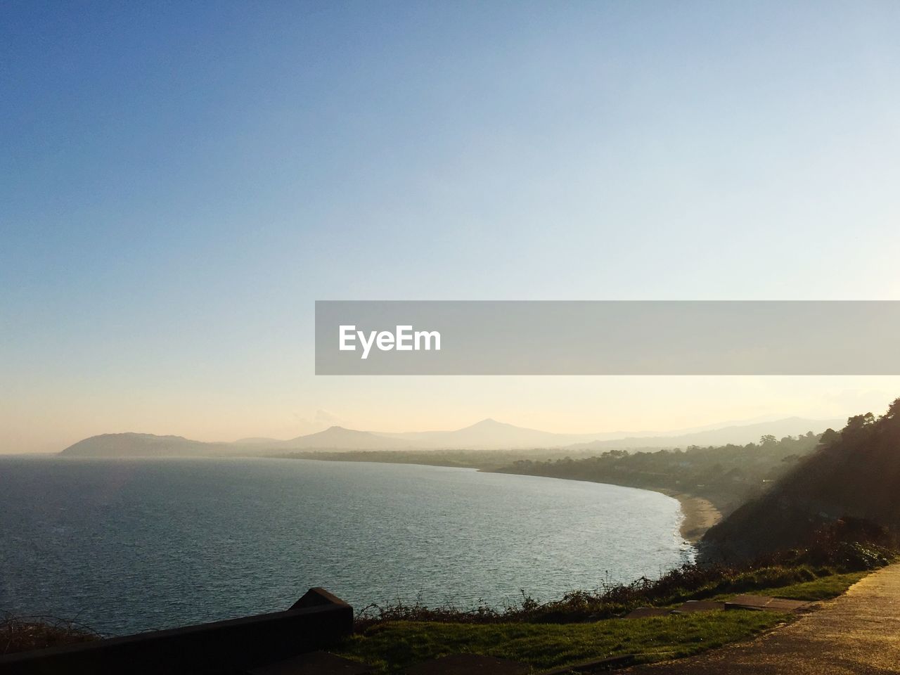 High angle view of sea against clear blue sky