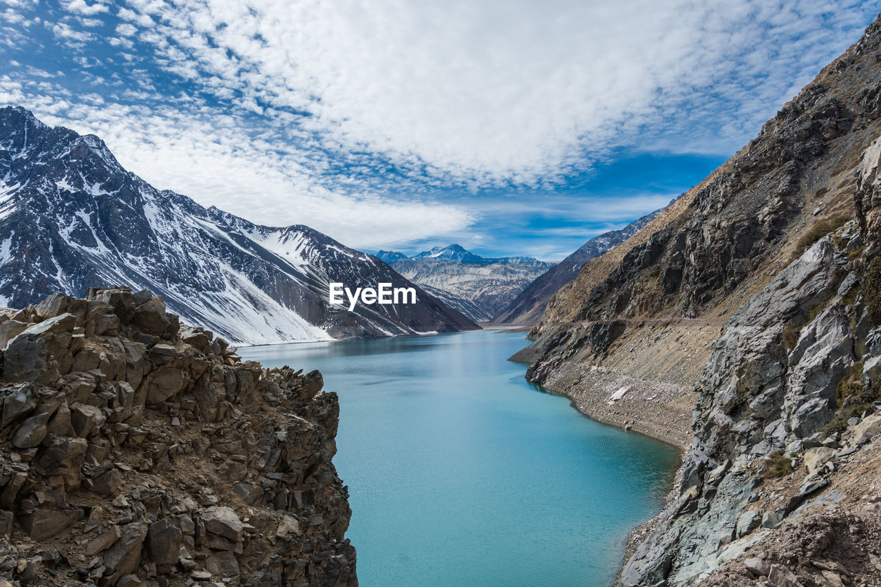 Scenic view of lake and mountains against sky