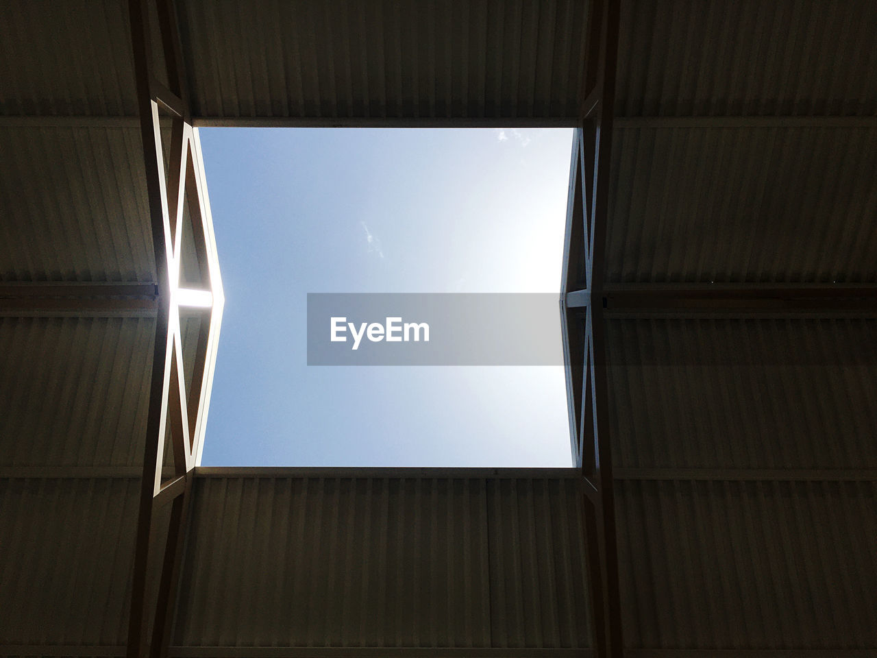 Low angle daytime view of an open skylight