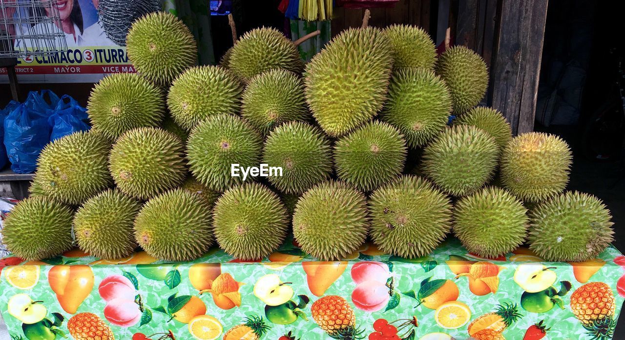 Durians for sale at market stall